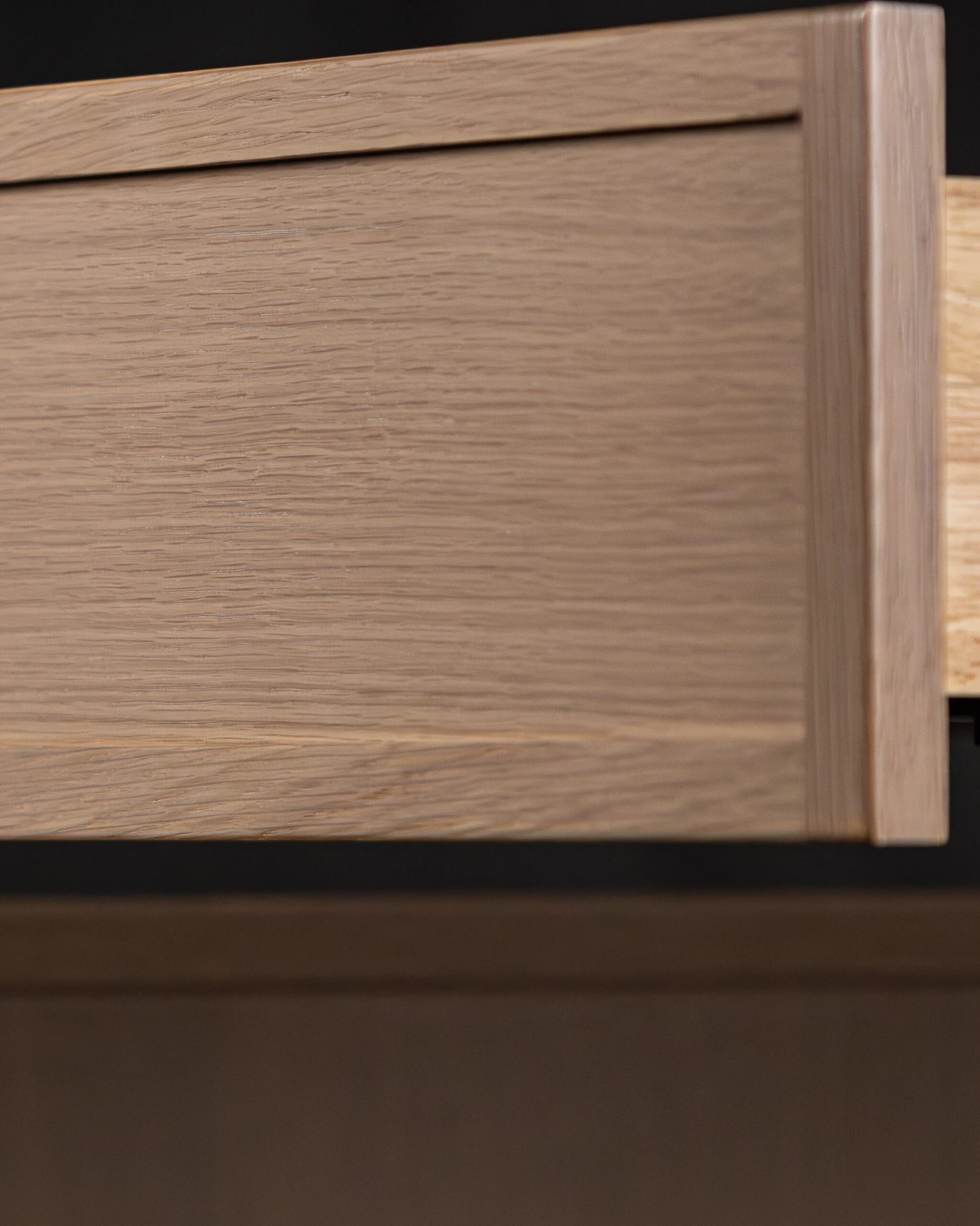 Slim shaker oak drawer face with natural wood grain and minimalist profile