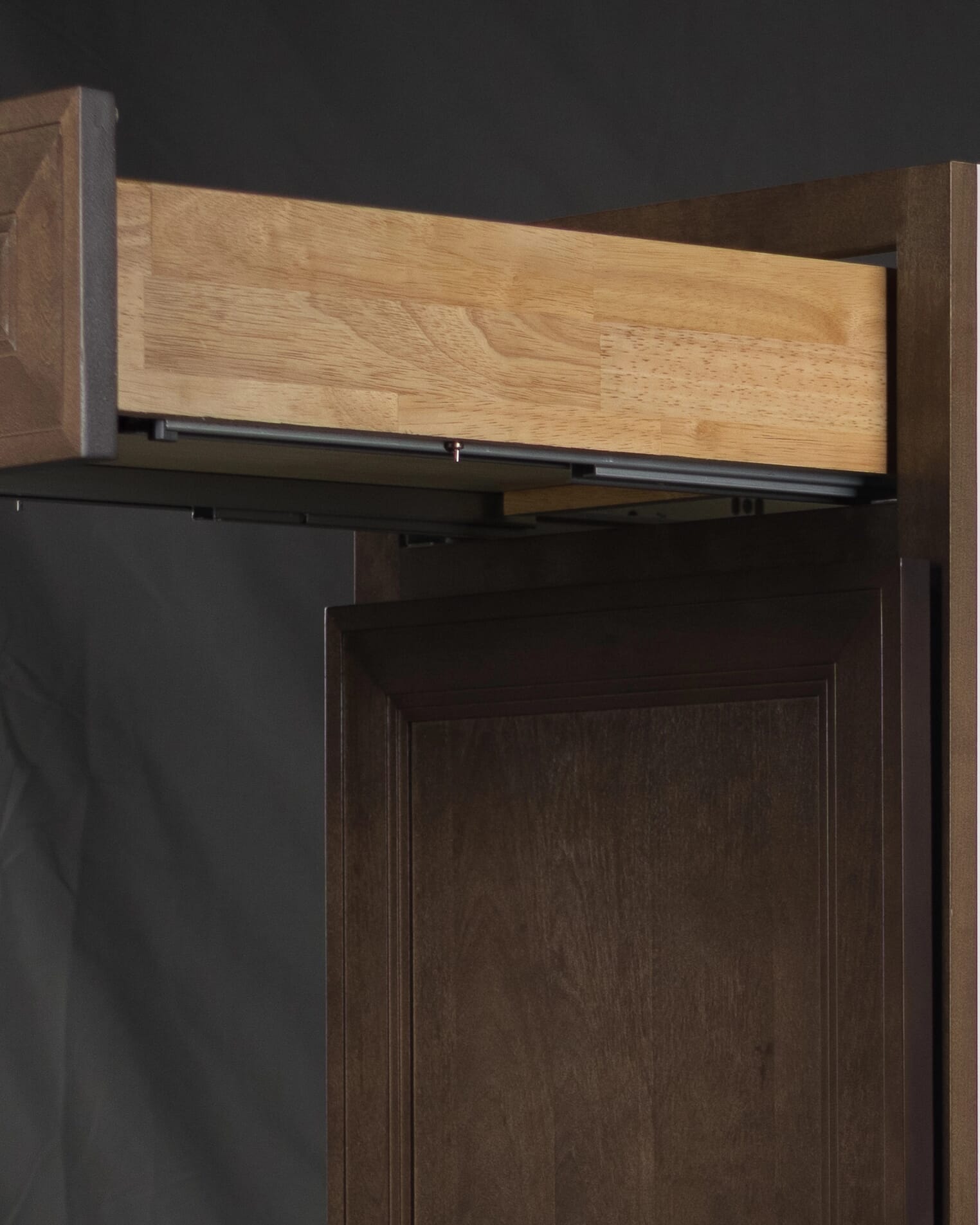 Close-up view of a Tuscany cabinet drawer box featuring full dovetail joinery